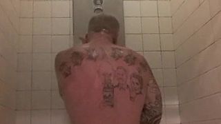 Prisoner showers after haircut