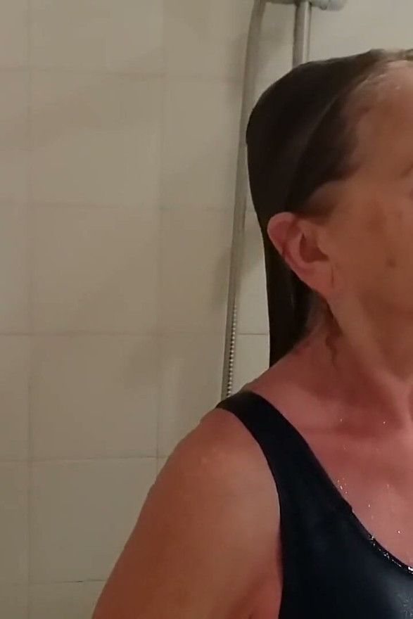 Grandma in a Tight Swimsuit Taking a Shower!