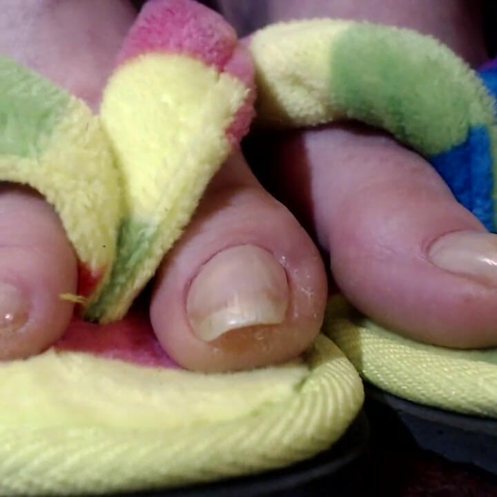 Long natural toenails flip flops