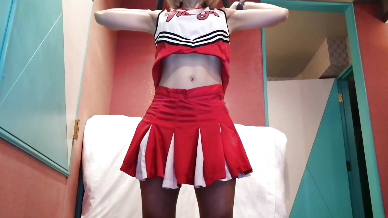 A cute, busty married woman does five exercises in a sexy cheerleader costume. Peeking down from below. Home made amateur Private Shoot