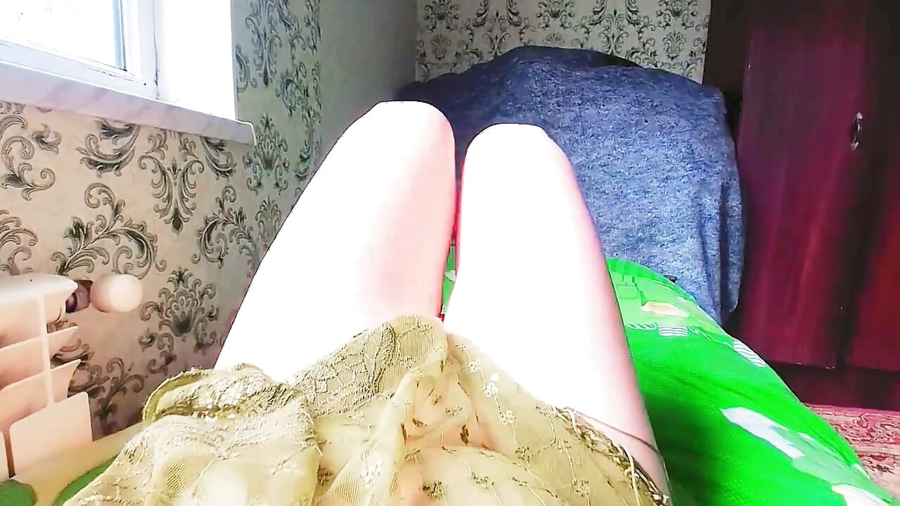 Cute sissy reading romantic novel by window light
