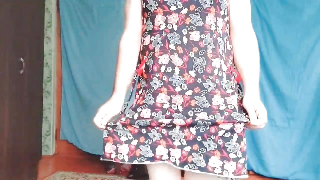 Playful trans girl showing thigh tattoo in short skirt
