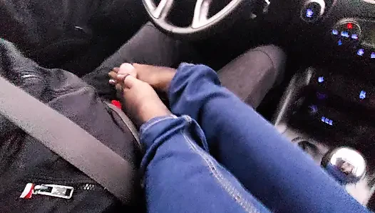 Amateur MILF in jeans and nylon socks gives a taxi driver a footjob