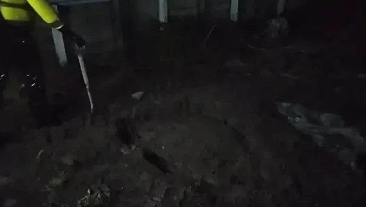 Latex Biohazard Drone Plays in Mud Pit