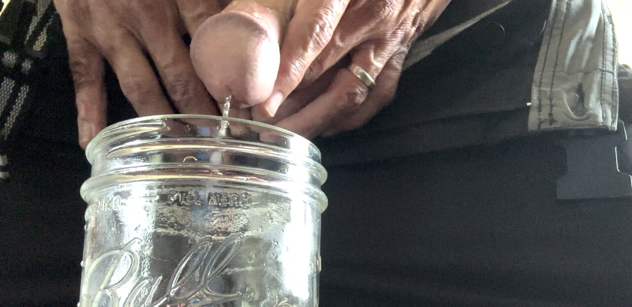 Erotic pissing in jar and masturbation
