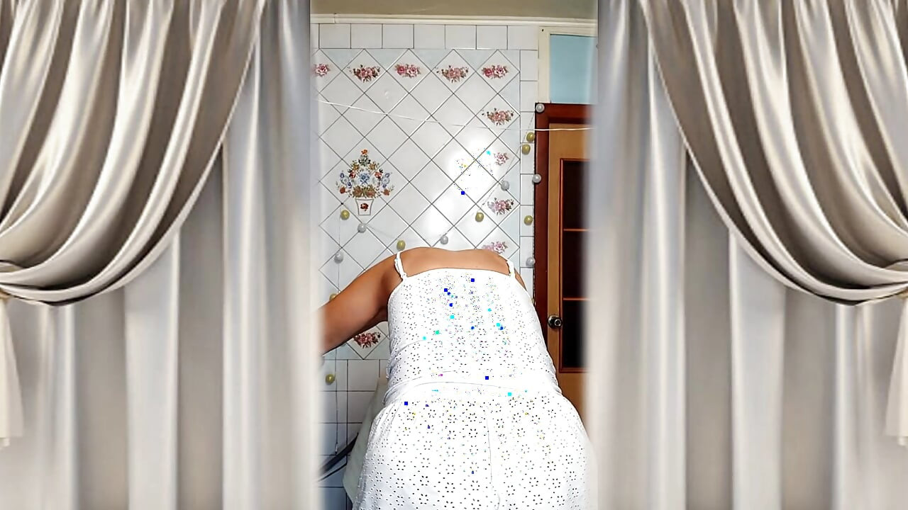 Hot housewife Lukerya. A mature Ukrainian woman shows off her figure and poses for the camera at home.
