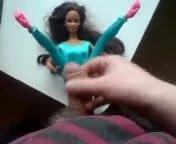Barbie in tight blue dress gets some cum.