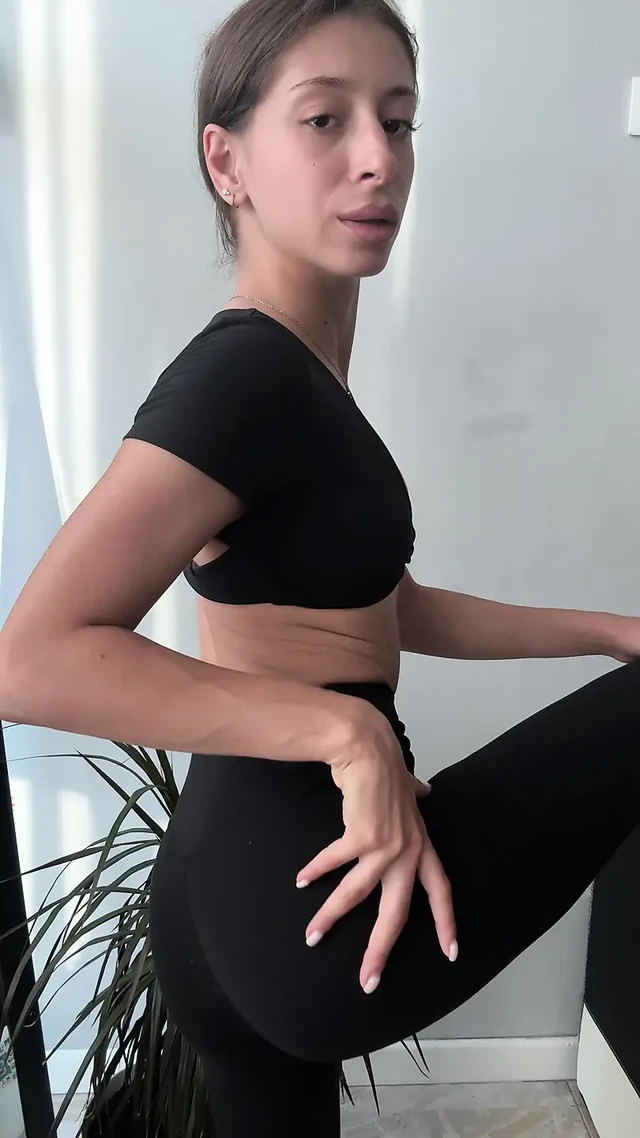 Playful Latina Undresses with a Wink