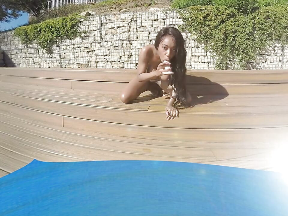 Hot Friends Under the Sun Two Friends Sunbathing on a Beautiful Terrace with a Pool