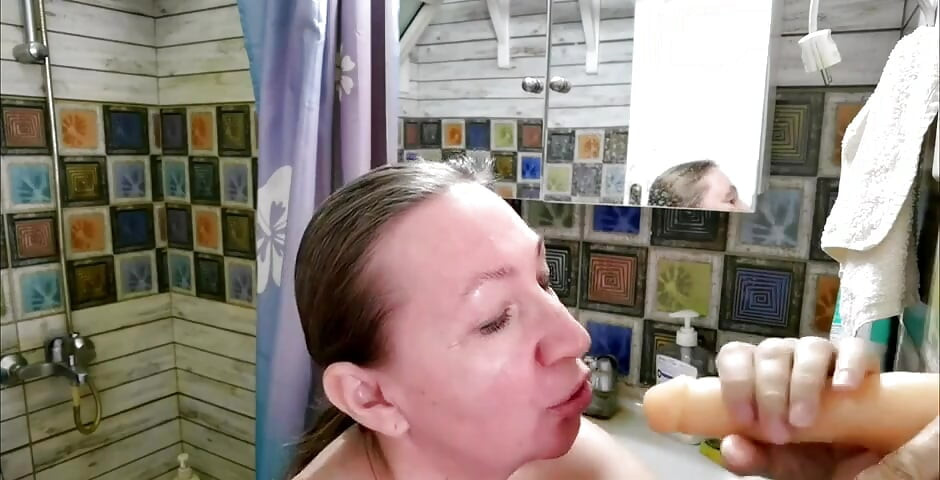 Sucking a big dildo and i smear cum all over my chest