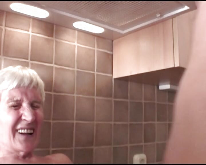 Blonde German granny gats a facial after fuck in kitchen