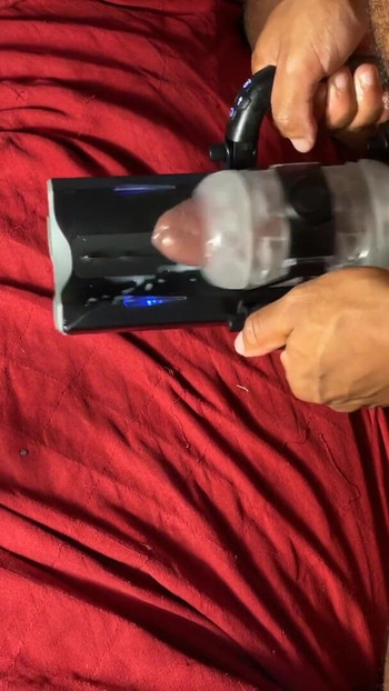 Stunning moment from "Autostroker Milks Out A Moaning Cumshot From Black Dick"