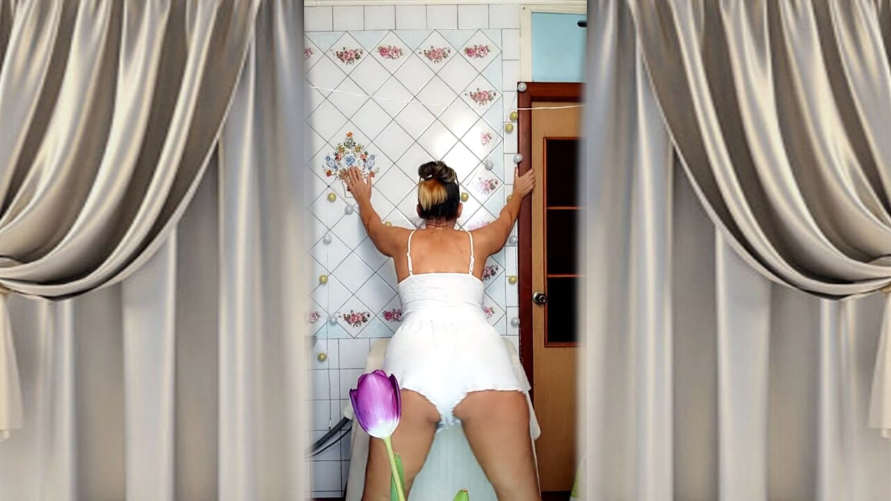 Mature housewife Lukerya twerks her curvy figure in white shorts in the kitchen, hot flirting and teasing movements