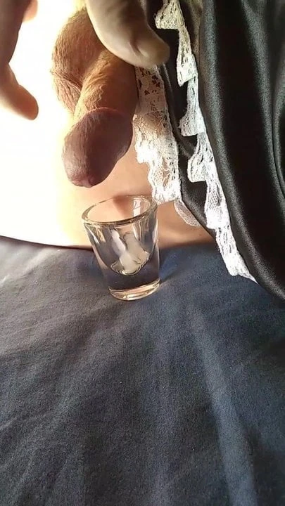 Wearing my french maids skirt and wanking into a shot glass.