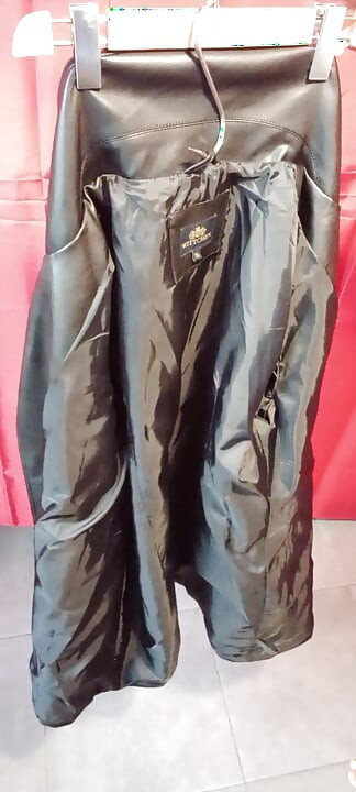 Ejaculating on the lining of her black leather coat