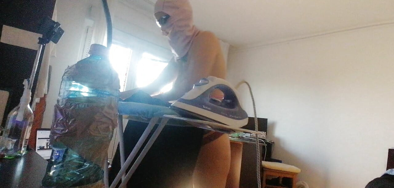 Amateur wife doing housework naked. Sexy and naughty wife trying on the clothes she cuts.