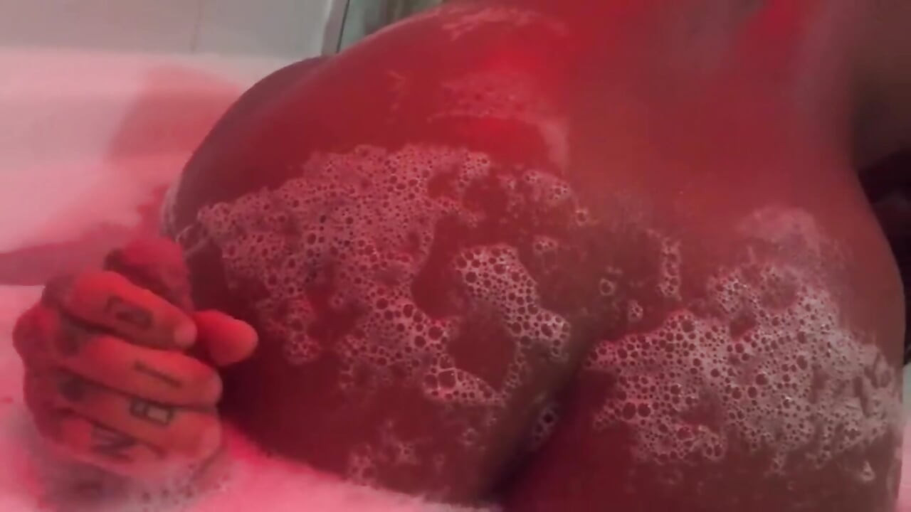 Eating brunette's big ass in the bathtub