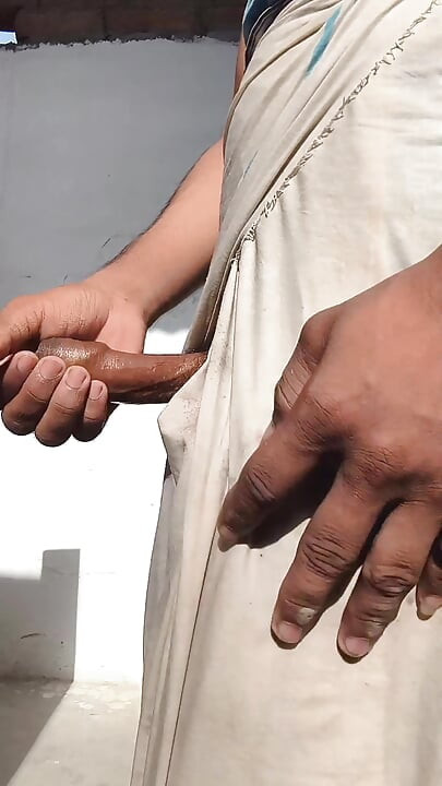 Young guy rubs his thick penis with oil