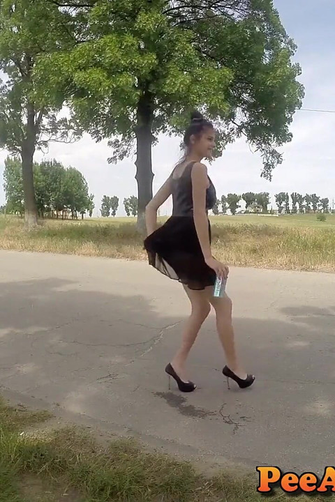 Wetting the road in dress and high heels!