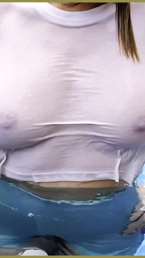 Wifey goes braless in a public exhibitionist dare in a public pool | Clip 1