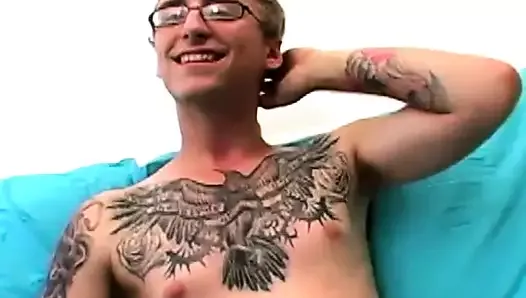 Geeky amateur with glasses and tattoos strokes his big cock