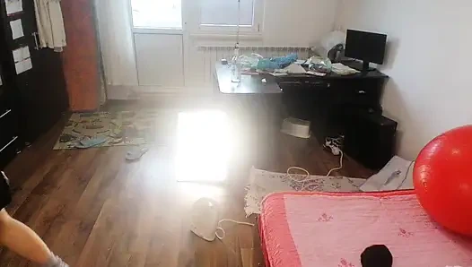 Amateur woman has fun trying on clothes and cutting them.