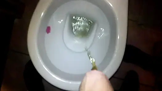 My wife holds my cock when I pee and then we fuck