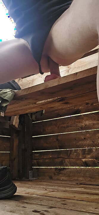 Riding a big dildo on a high seat in the forest
