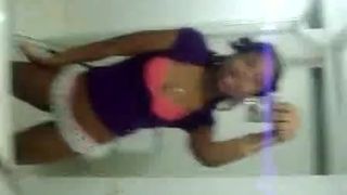 Cute black girl records herself teasing in the bathroom