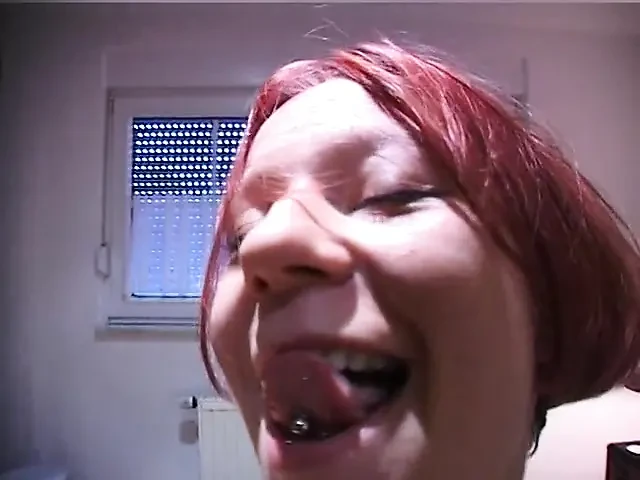 Redhead teen rubs and fingers her wet twat