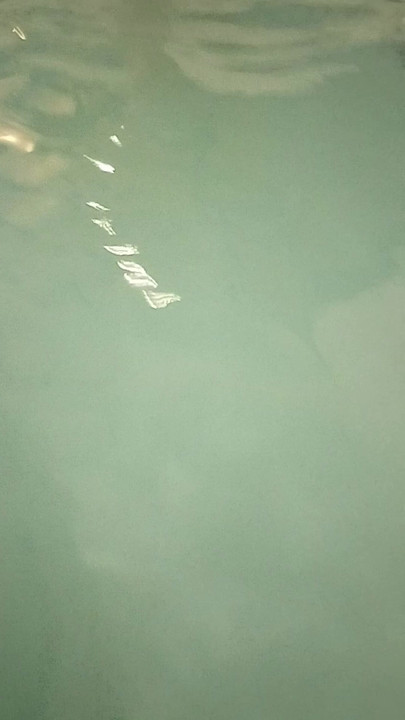 Wife playing in hotel hot tube.