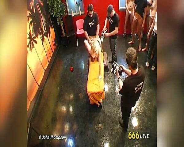 Blonde Bukkake Slut Pissed on and Covered in Cum by Group