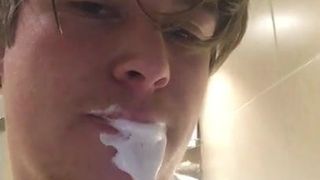 Young guy takes hot facial and spits it back out