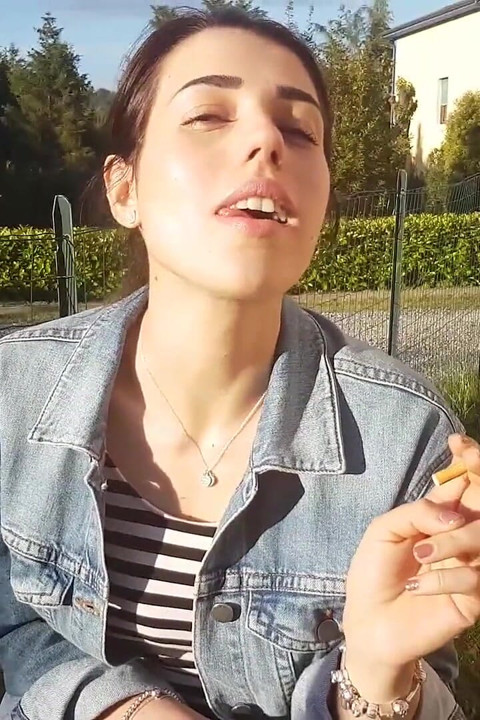 Petra smokes her ciggaretes outdoor