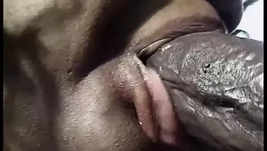 Black slut strokes giant cock with her fat tits in pool chair