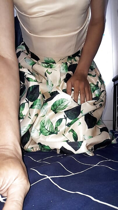 Cum wearing satin set of tank top and skirt