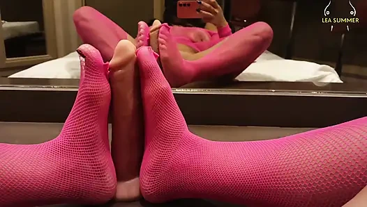 A milf with a large vagina masturbates with her dildo using her feet, then inserts a black dildo.