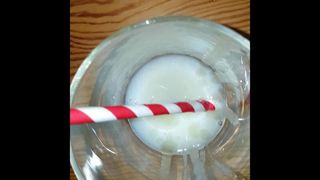 Big cumshot into a glass with a straw