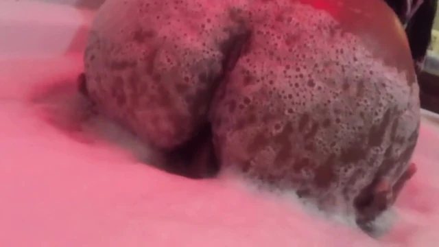 Eating brunette's big ass in the bathtub