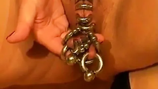 Heavy pierced pussy with heavy weights hanging