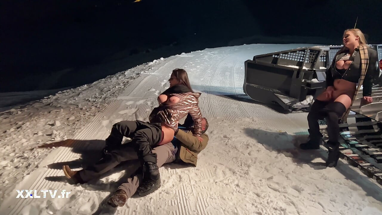 Nighttime ski slope threesome