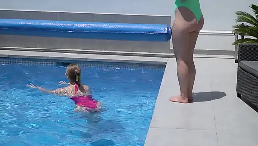 Lesbian Girls Are Having Fun in a Pool with an Inflatable Shark