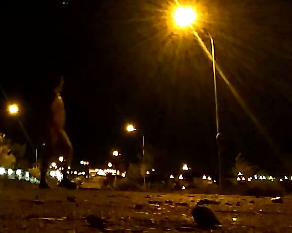 Naked on a quiet street at night