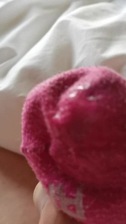 Sperma i fruens rosa strumpa