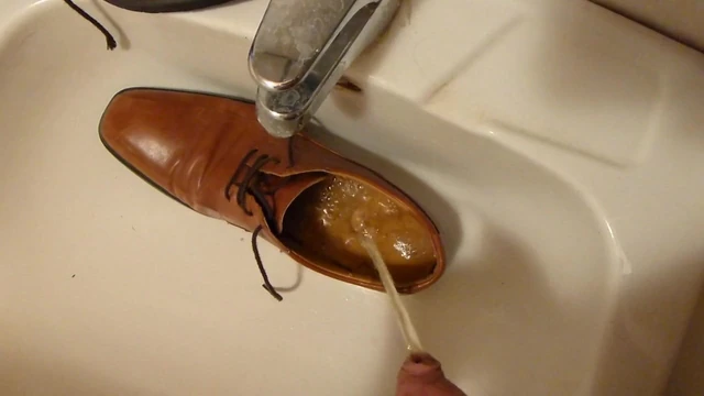 Piss in men's dress shoe