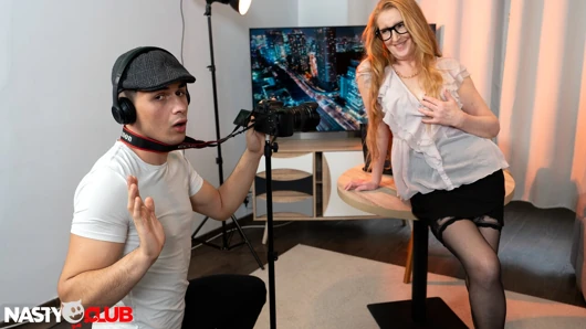 MatureClub - Redhead Mature Showhost Discovers New Cameraman has Monster Cock