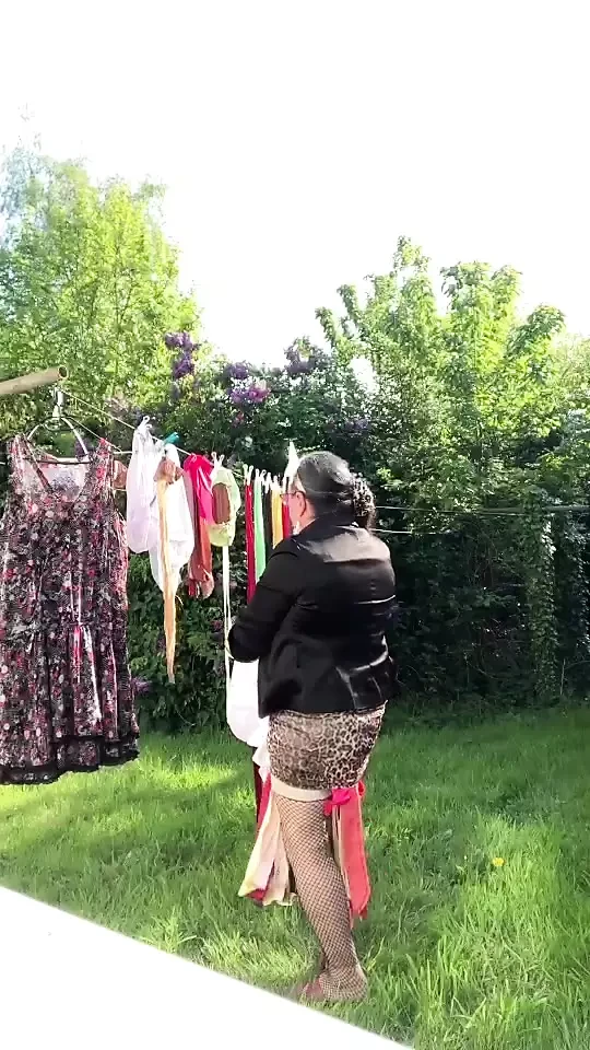 In attire with a little leopard skirt for a day and to hang the laundry.