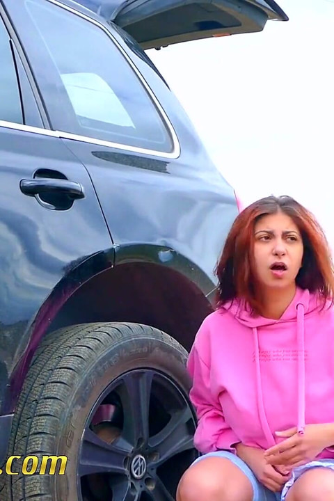 Pee next to the wheel of the car