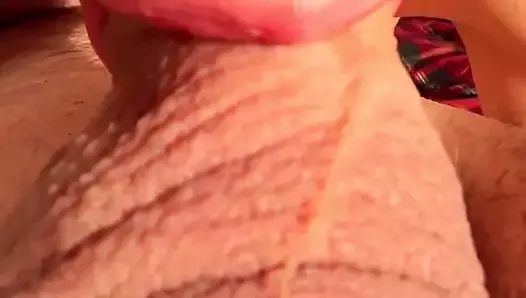 Man's penis head is in a lover's mouth