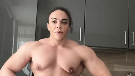 Ebony mom wears dominance like armor over muscular hips